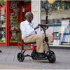 Image of Man riding the eFoldi Lite Lightweight Mobility Scooter Outdoors