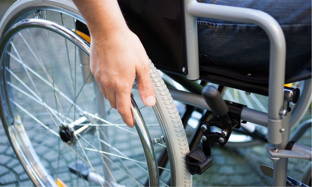 What is the difference between a standard wheelchair and a power wheelchair?