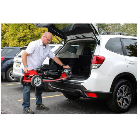 Amigo TravelMate Folding 3 Wheel Mobility Scooter Red Color Folded View Being Carried to a trunk of a Car