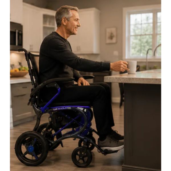 Man in a Forcemech Ultralite G20 in Blue in a kitchen holding a cup