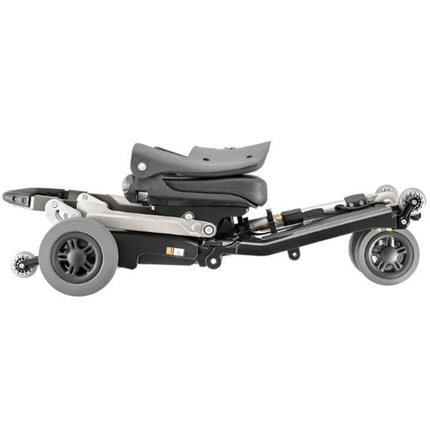 FreeRider Luggie Classic II Travel Scooter Metallic Gray Color Folded Flat on the Floor View