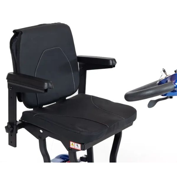Black padded chair seat with armrests, shown on a white background with part of the blue wheelchair frame and handlebar visible on the right.