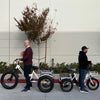 Image of Go Bike TRIO Crossover Lightweight Foldable Electric Tricycle with Two People on it - Side View