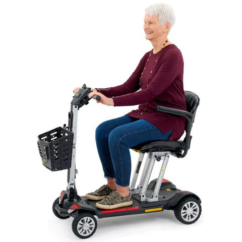 Golden Technologies Buzzaround Carry On Folding Mobility Scooter GB120 with female rider