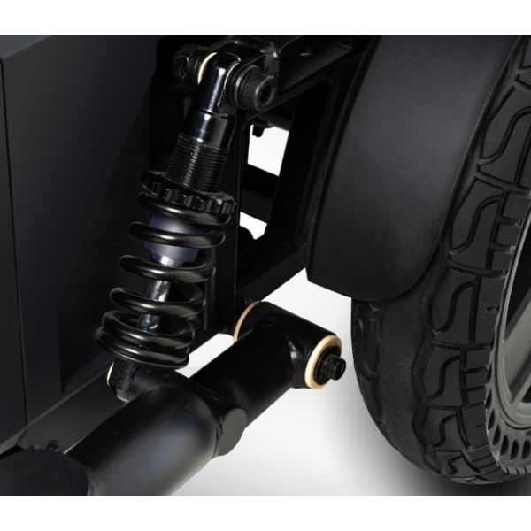Close-up of the Pride Jazzy EVO 614 suspension system on a white background