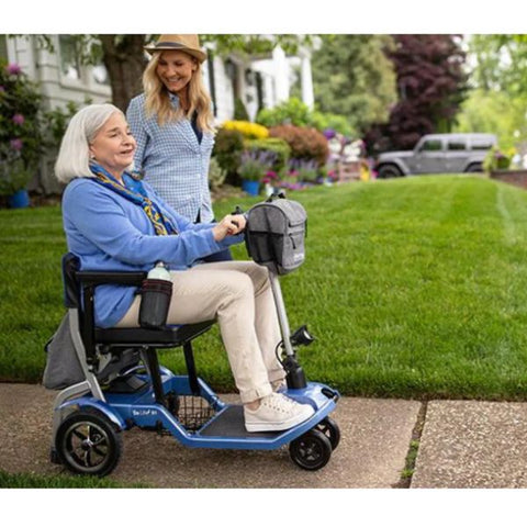 Lady riding the Journey So Lite™ Lightweight Folding Scooter Right Side View