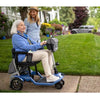 Image of Lady riding the Journey So Lite™ Lightweight Folding Scooter Right Side View