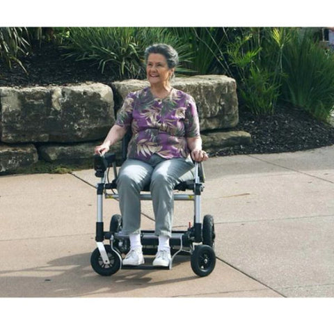 Lady riding the Journey Zoomer Chair outdoors