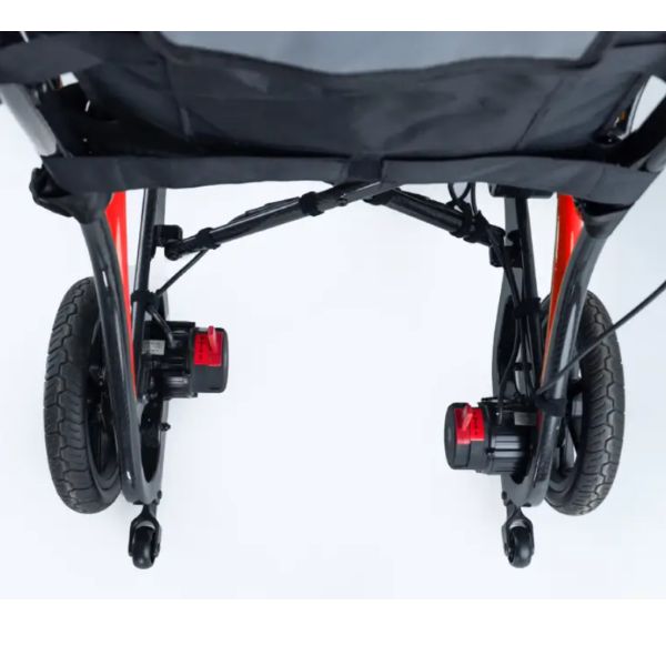 Close-up rear view of Monarch Mobility Ezi Fold Carbon Ultra-Lightweight Folding Electric Wheelchair with black casters on a white studio background.