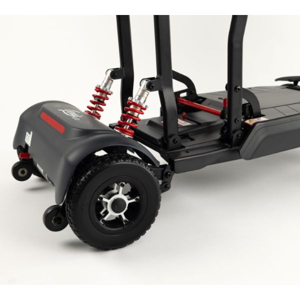Monarch Mobility Genie Auto Folding Mobility Scooter showing the rear wheel, suspension springs, and deck on a light gray studio background.