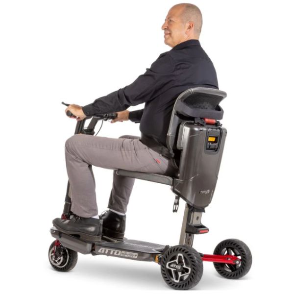 Moving Life Luxury Orthopedic Backrest Leather  Shown Being Used by a Rider on the Atto Scooter