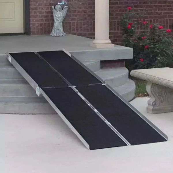 PVI Multi-fold Bariatric Ramp on a set of outdoor steps with a decorative garden in the background.