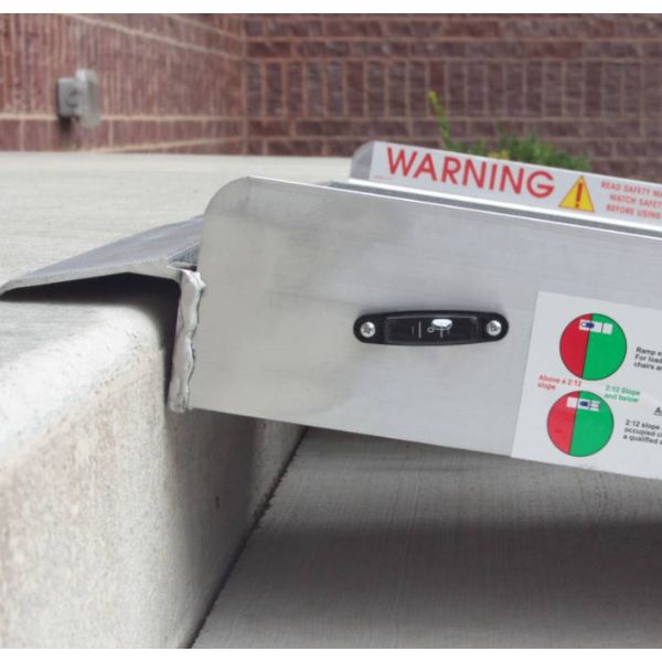 PVI Multi-fold Bariatric Ramp with warning label on a concrete surface