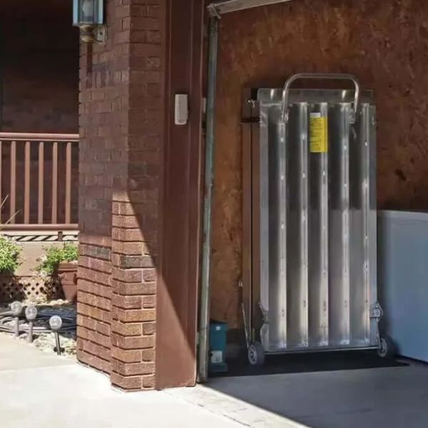 PVI Wheel-A-Bout Portable Wheelchair Ramp being installed on a brick building
