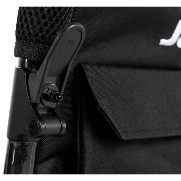 Close-up of a black bag with a strap and buckle detail