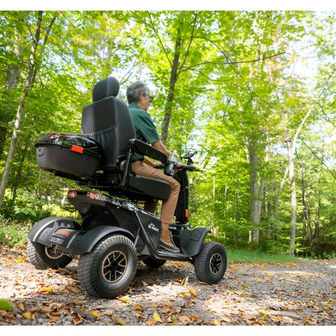 Pride Baja Wrangler 2 Heavy Duty Scooter with Rider Right Backside View