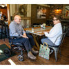 Image of Pride Jazzy Ultra Light Portable Power Chair  Side View with Rider