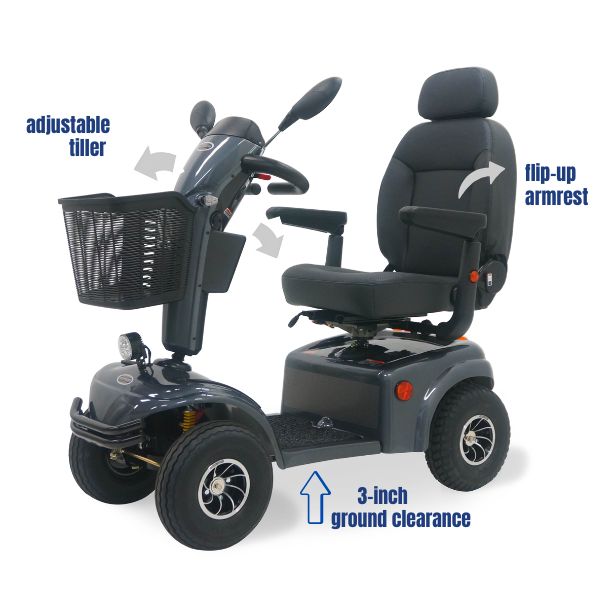 Shoprider Expedition XL4 4-wheel mobility scooter cruising outdoors on rough terrain with adjustable tiller and padded seat.