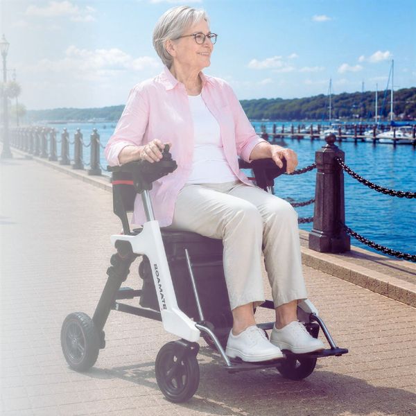 A Woman Riding on Roamate 3-in-1 Rollator Transport Electric Wheelchair Outdoor