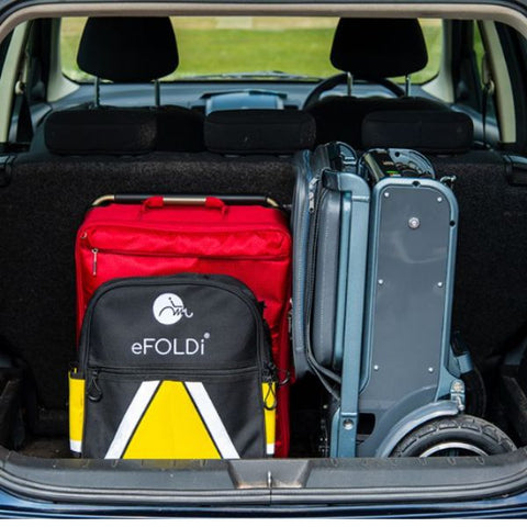 eFOLDi Explorer Ultra Lightweight Mobility Scooter in the back trunk of  a car