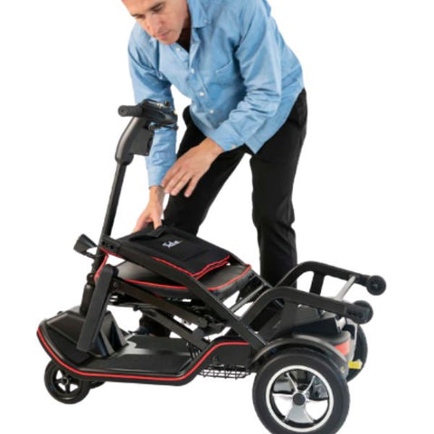 Man folding the Feather Lightweight Electric Scooter 