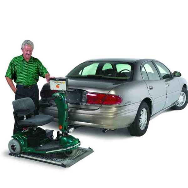 Harmar AL100HD Heavy Duty Platform Scooter Lift shown carrying a scooter on the back of a vehicle.
