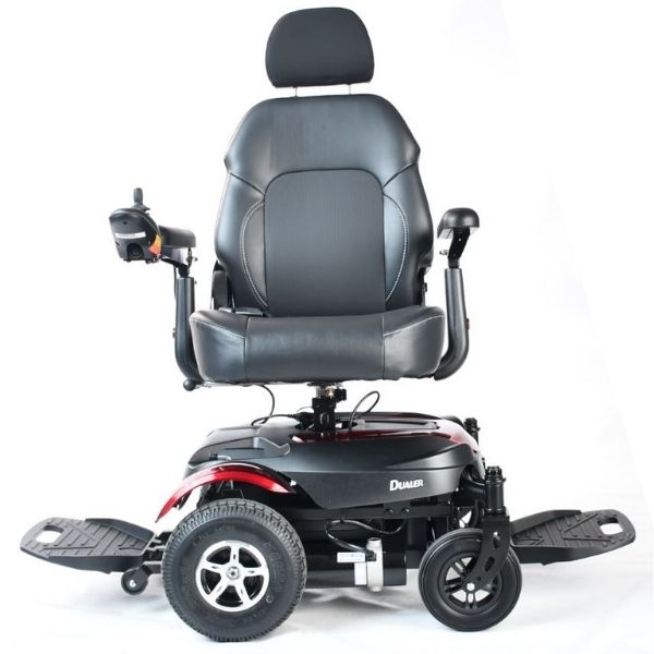 A black and red Merits Health P312 Dualer Power Chair with seat swivel feature, displayed in a side view.