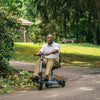 Image of Pride Mobility iRide 2 Ultra Lightweight Scooter Road Riding View