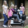 Image of Quingo Vitess 2 Mobility Scooter Woman on Scooter With Kids